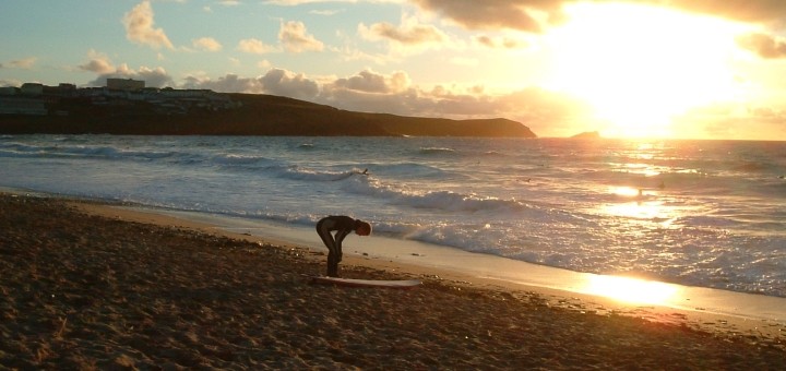 Surfer on beach at Newquay. Photograph by Ali Taylor